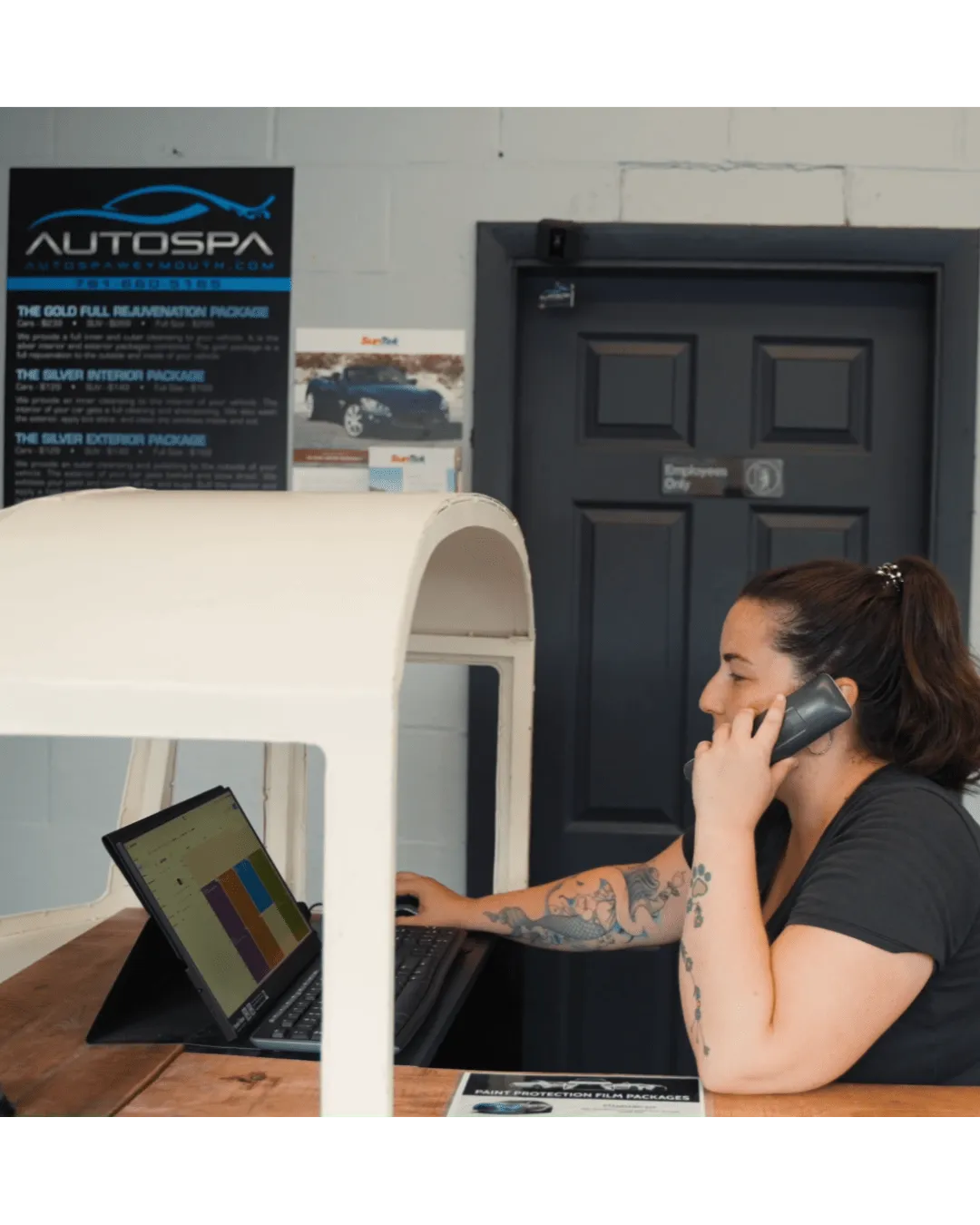 AutoSpa Weymouth team member providing customer service